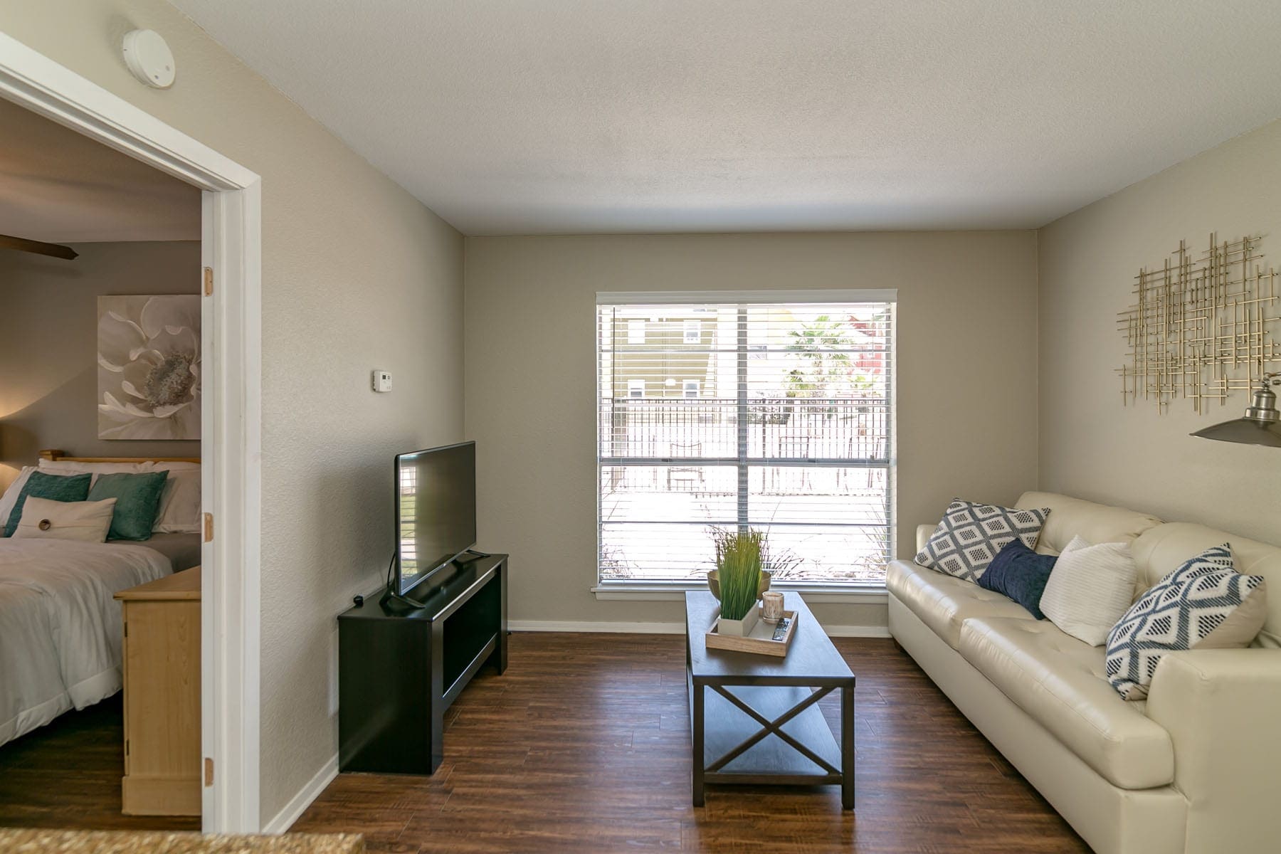 San Antonio Apartments for Rent - City-Base Vista Spacious Living Room with Wood-Style Plank Flooring and Large Window