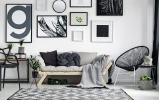 Wooden,Sofa,With,Dark,Pillows,In,Scandi,Style,Living,Room
