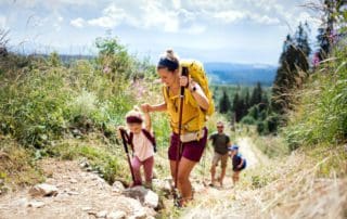 Family,With,Small,Children,Hiking,Outdoors,In,Summer,Nature,,Walking