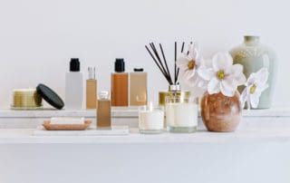 Shelf,With,Cosmetic,Bottles,,Vases,,Aromatic,Sticks,,Candles,,Soap,And
