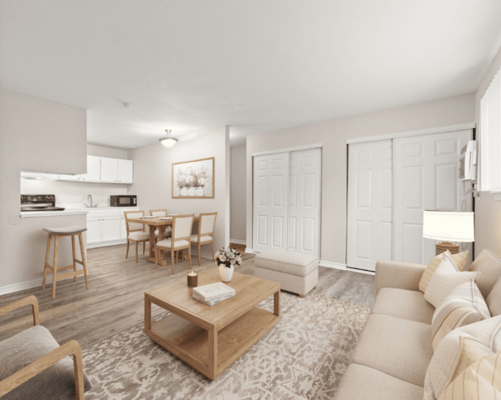 Interior view of a stylish living room and kitchen at City Base Vista in San Antonio, Texas, featuring contemporary furniture and neutral colors.